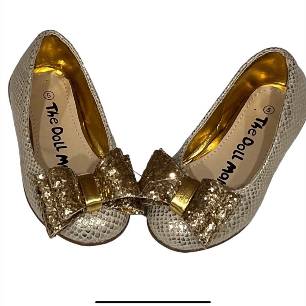 Brand new Doll Maker Shoes . Sparkly golden the doll maker slip on shoes.